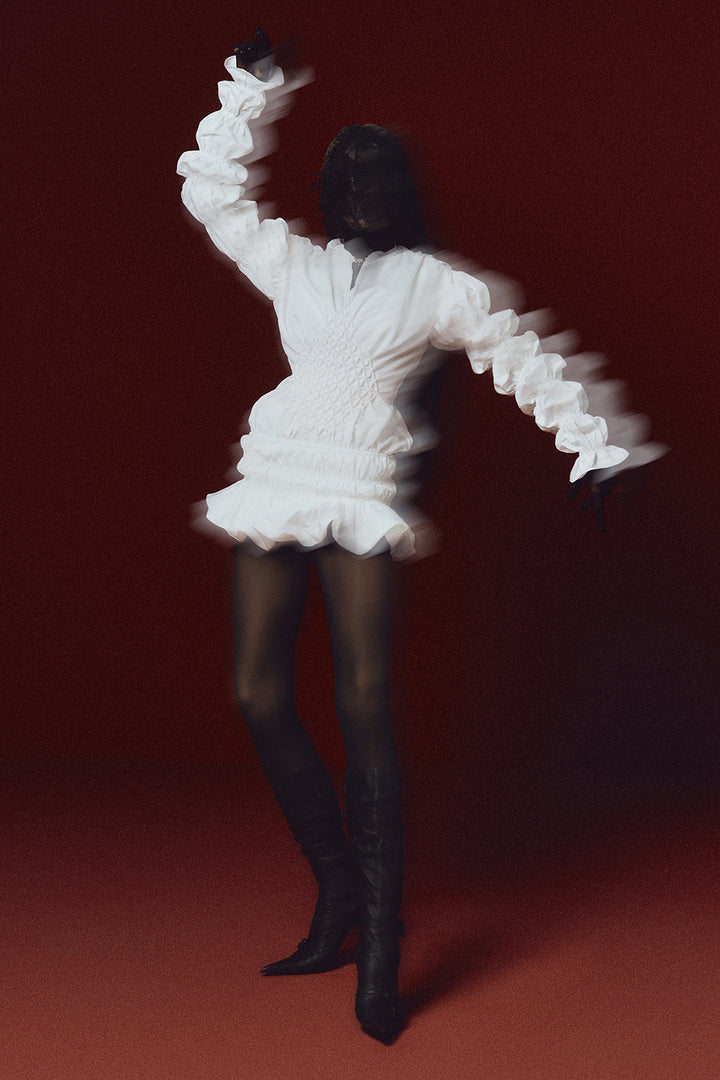 The Swan of Avon Peplum Smocking Mini Dress - MEAN BLVD